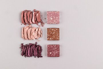 Three gorgeous samples of smear-free eyeshadow and square samples of refill in delicate colors on a white background. top view. Flat lay. copy space