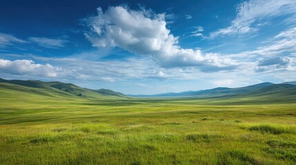 Fototapeta premium Expansive Green Meadow Under a Bright Blue Sky with Fluffy Clouds and Rolling Hills in the Distance, Evoking Serenity and Natural Beauty in the Landscape