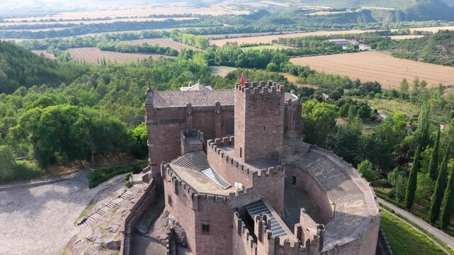 Drone footage flying over the medieval javier castle, a famous historical landmark and pilgrimage site located in the region of navarre, spain