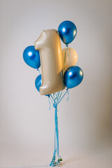 Photo of one foil balloon at child's birthday party on white background.