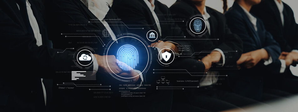 Professionals in formal attire engage in a serious discussion on cybersecurity and digital authentication, focusing on building trust in innovative technology solutions. Trope - Powered by Adobe