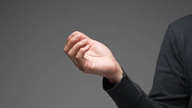 Man's open palm gesture in various close-up shots against a gray backdrop