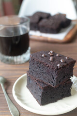 Chocolate Brownies with Chocolate Chips on a Wooden Board