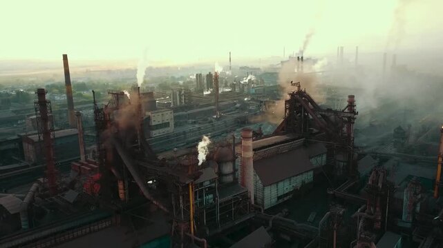 A drone flyover of a steel plant demonstrates the environmental impact and smoke from the chimneys.