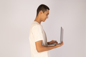 Man using laptop in profile