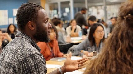 Medium shot of an instructor engaging a diverse group in a bright classroom discussing tenant rights and responsibilities during an interactive workshop. - Powered by Adobe