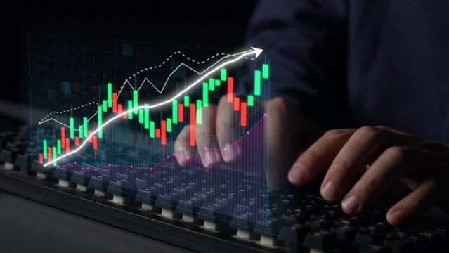 A professional trader is focused on analyzing digital financial data with hands typing on a keyboard. The chart features colorful candlestick patterns depicted clearly. Copula - Powered by Adobe