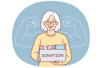 Grandmother holds donation box, wanting to help needy people in trouble, stands near phantom biceps