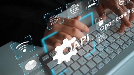 Hands Typing on Keyboard with Icons Representing Open Banking, API, and Digital Finance for Technology Integration and Innovation in Financial Services Gluon.