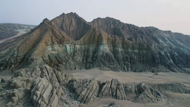 Exposed layered geological ridge with sedimentary rock strata and eroded mineral textures