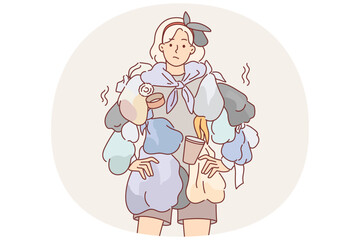 Woman wearing clothes from trash draws attention to problem recycling waste to care for environment