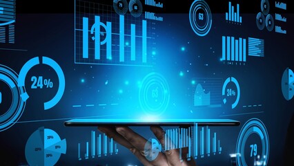 A vibrant display of futuristic data visualization projected from a tablet, showcasing diverse graphs and analytics for modern business intelligence and decision-making. Xenic