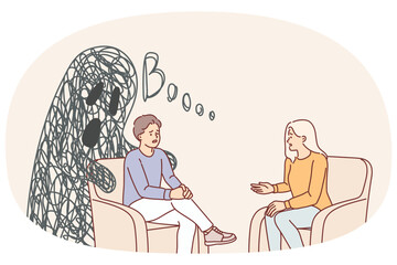 Man and psychotherapist sit in chair talking about fears and problems that interfere