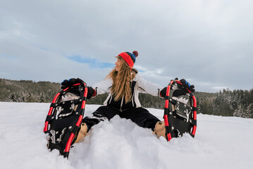 Person Snowshoeing in Snowy Outdoor Landscape