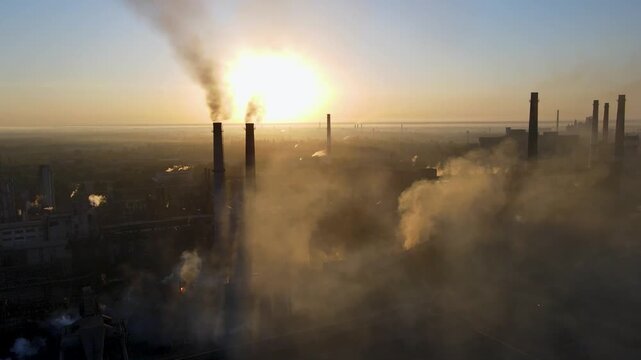 A drone flyover of a steel plant demonstrates the environmental impact and smoke from the chimneys.