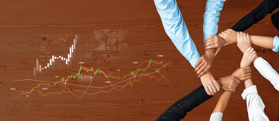 Dynamic visualization of teamwork in a business setting, showcasing hands united on a table with financial graphs illustrating growth and market strategies. Scalp