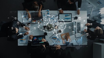 A dynamic business meeting scene showcasing professionals collaboratively analyzing data with laptops and charts, emphasizing teamwork and innovative concepts in a modern office. Raster