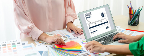 Invoice on computer screen from accounting application. Computer program for financial and budget...