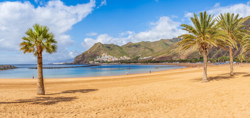 Las Teresitas Beach with its golden Sahara sands, nestled by Tenerife lush Anaga Mountains, and the charming San Andres village.
