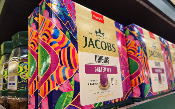 Boxes of jacobs origins guatemala coffee capsules displayed on a shelf at a supermarket providing a premium selection of arabica coffee for espresso machines and home use