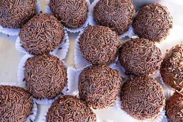 A selection of Brazilian sweets known as brigadeiros, photographed from top to bottom