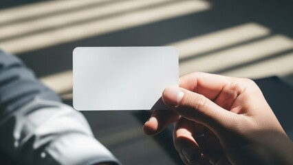 Hand holding blank business card