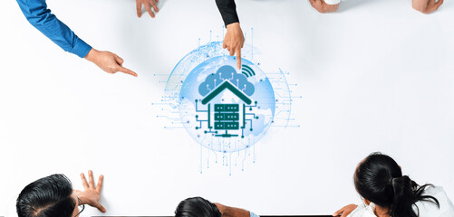 A diverse team of professionals collaborates on cloud computing concepts, emphasizing teamwork and innovation in a modern workspace during a productive brainstorming session. Trope