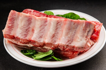 Obraz premium Ribs raw meat pork food preparation tasty snack fresh delicious gourmet food background on the table rustic food top view copy space