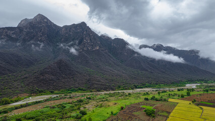 Panoramic aerial drone view of the mountains of Mayasc&oacute;n covered by clouds, Lambayeque, Peru