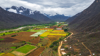 Aerial drone view of the valley and village of Mayasc&oacute;n surrounded by mountains in Lambayeque, Peru