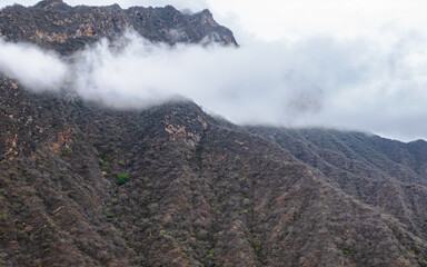 Panoramic aerial drone view of the mountains of Mayasc&oacute;n covered by clouds, Lambayeque, Peru