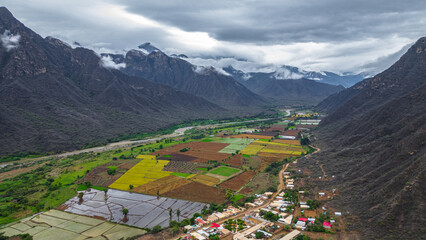 Aerial drone view of the valley and village of Mayasc&oacute;n surrounded by mountains in Lambayeque, Peru