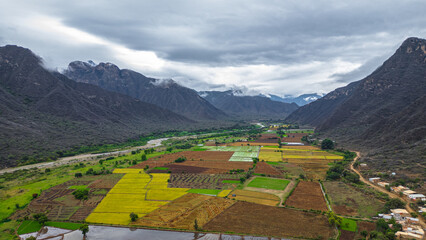 Aerial drone view of the valley and village of Mayasc&oacute;n surrounded by mountains in Lambayeque, Peru