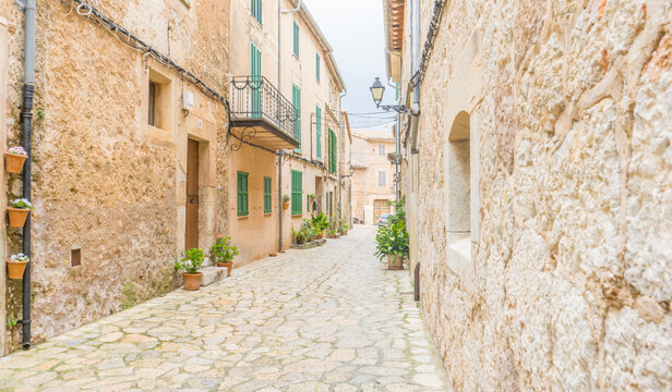 Destination, Beautiful street in Valldemossa with traditional flower decoration, famous old mediterranean village of Majorca. Balearic island Mallorca, Spain