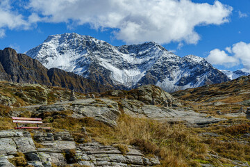 Alpine mountains in autumn, San Bernardino Pass in Switzerland The sky is blue, light, cloudy