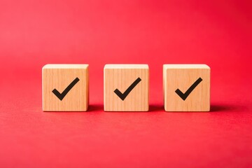 Three Wooden Blocks with Check Marks on Red Background Concept