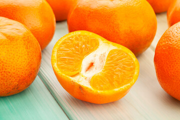 sliced tangerine on wood background