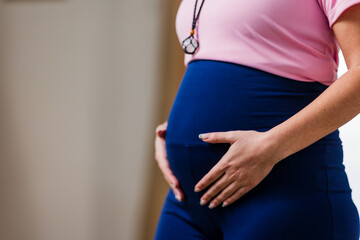 Pregnant woman exercising, embracing health and wellness