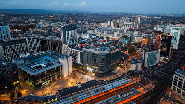 Aerial drone photo of Cardiff city centre at night, featuring Central Square, BBC studios, bus and railway stations.