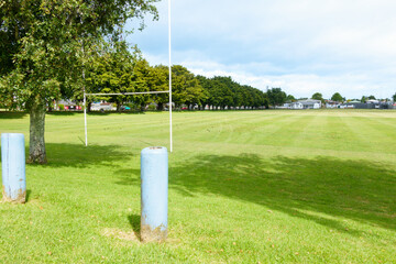 Rugby field and grove of totara trees planted on Nicholson Field along Fifteen Avenue commemorating past pupils of Tauranga Boys College lost in World War 11.