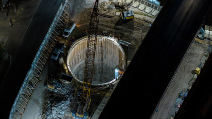 Fototapeta premium Aerial HDR Night View of I-35 Tunnel Excavation Shaft Between Highway Decks