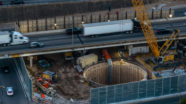 Aerial View Highway Construction with Crawler Crane and Foundation Shaft
