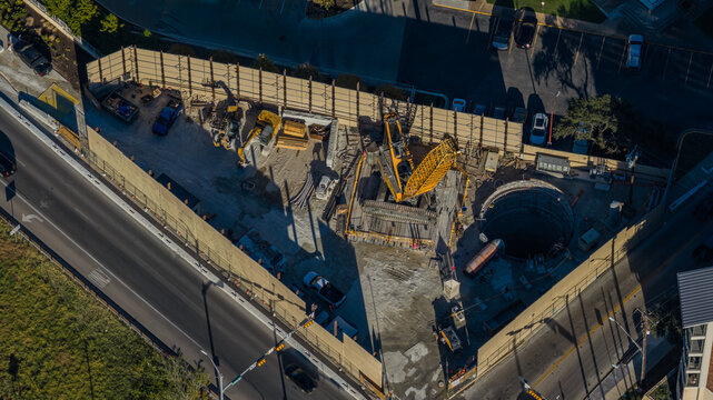 Aerial Top-Down View Urban Construction Site with Crane and Foundation Shaft