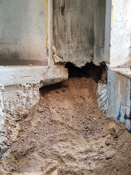 Structural Subsidence and Eroded Building Foundation Requiring Underpinning