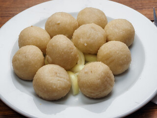 Serving or round traditional Polish dumplings on a white plate. Tasty simple food. Healthy meal...