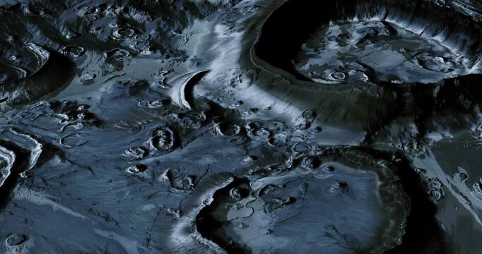 Surfaces of the moon exhibit a variety of craters and rugged terrain under an ethereal glow. This close up reveals intricate details of lunar topography and formations.