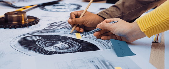 A vibrant scene capturing hands engaged in a collaborative sketching session, emphasizing creativity and teamwork in the design process among diverse individuals. SACTR