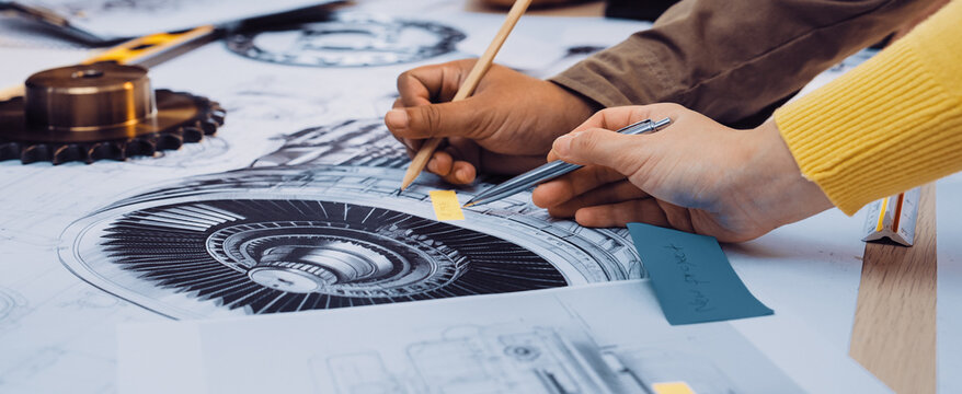 A vibrant scene capturing hands engaged in a collaborative sketching session, emphasizing creativity and teamwork in the design process among diverse individuals. SACTR - Powered by Adobe