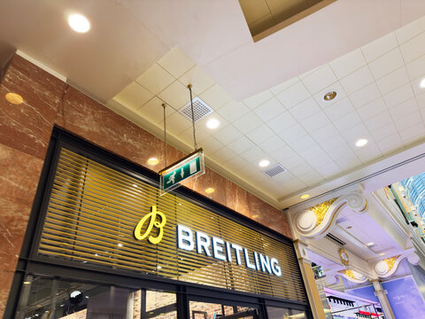 Breitling store storefront in Manchester shows luxury watch brand inside a modern mall