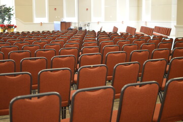 Fototapeta premium Meeting space, chairs set up for conference, meeting or gathering to hear a speaker or music